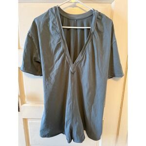 Free People Movement Hot Shot Tee Romper in an oversized fit and V-shapedsize Xs